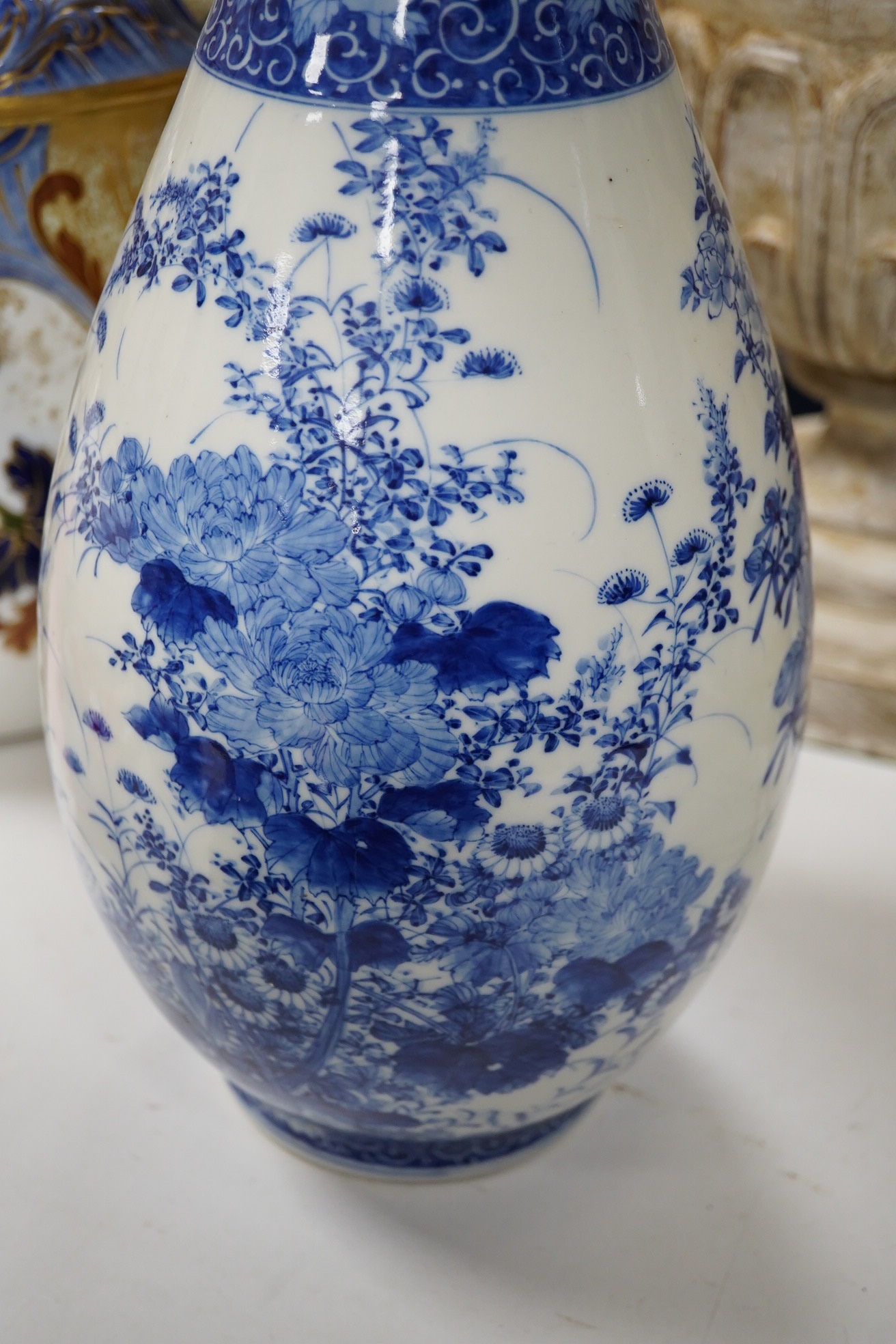 A large Japanese blue and white baluster vase, height 46cm. Condition - restoration to the rim